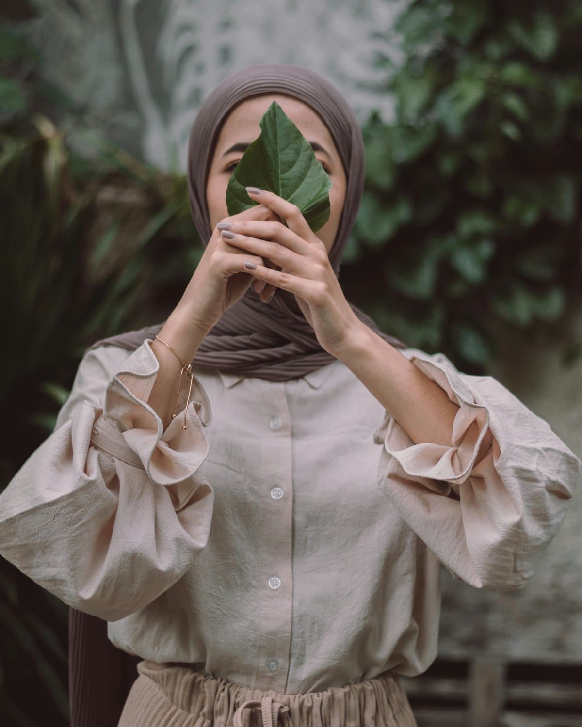 Soft bronze hijab styled for gatherings
